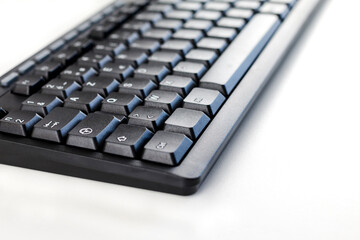 computer keyboard on white background, close-up, macro
