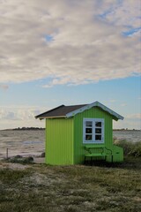  Green beach hut on the beach