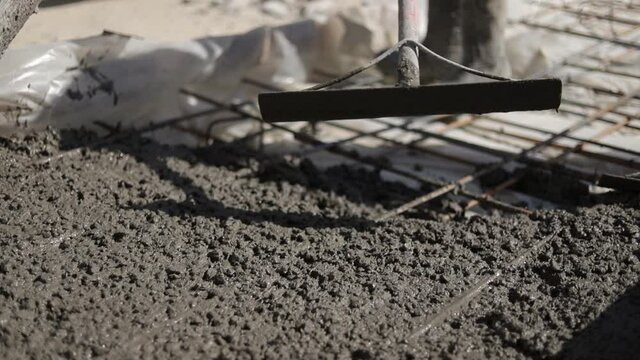 The concrete mix is ​​fed from a concrete mixer. Concreting. Concrete floor.