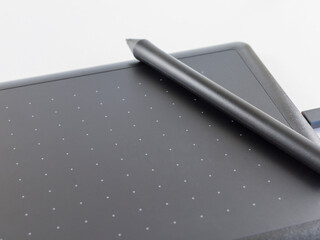 graphic tablet  with stylus on white background 