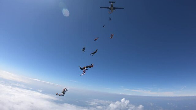 Formation skydiving. A group of skydiver is doing a figures in the sky.