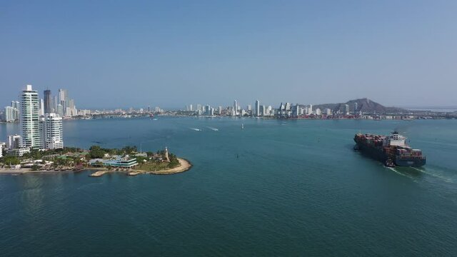 A container ship enters the harbor of Cartagena Colombia aerial view.