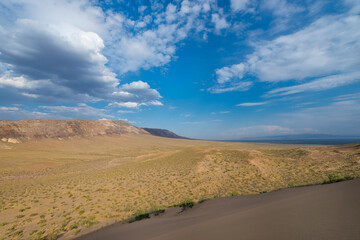 Fototapeta na wymiar Aktau Mountains viewed from the Singing dunes, Altyn-Emel National Park, Almaty region, Kazakhstan, Central Asia