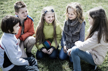 Fototapeta premium group of children in park in spring