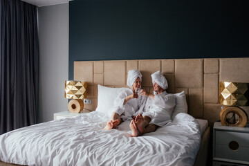 Man and woman in bath robes.