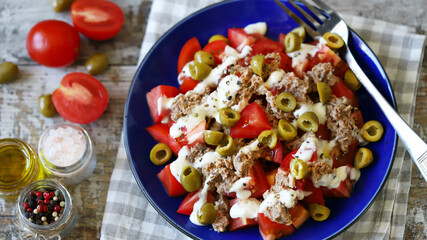 Salad with tuna, olives and tartar sauce. Healthly food. Fitness salad.