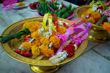 Garland in gold tray for the Buddha