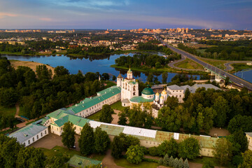 Fototapeta premium a panoramic view of the old fortress and church in the early morning at dawn filmed from a drone