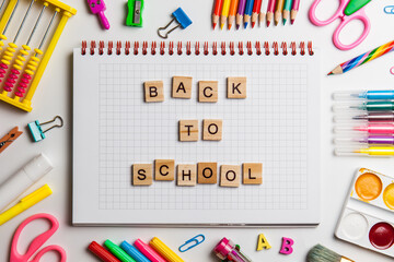 Back to school concept. Open notebook with school supplies