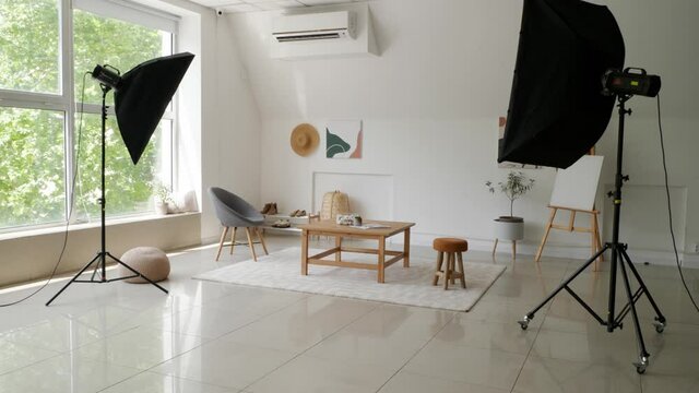 Interior of photo studio with furniture and modern equipment