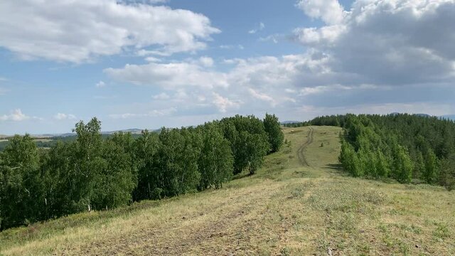 Panoramic view Beautiful natural landscape with fields of mountain forests Top View Nature of the South Urals Russian soul in the countryside