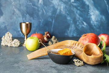 Shofar with honey and fruits on table. Rosh Hashanah (Jewish New Year) celebration
