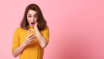 happy and surprise young woman good looking using mobile phone on pink copy space background. - obrazy, fototapety, plakaty