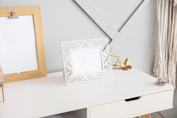 Photo frames on table in room