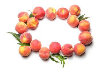 Frame made of ripe peaches on light background