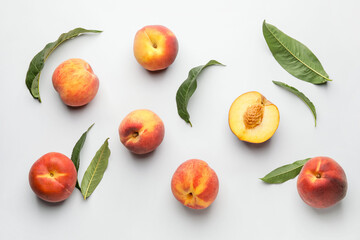 Many ripe peaches on light background