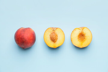 Ripe peaches on color background