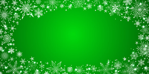 Christmas background with various complex big and small snowflakes, white on green, arranged in a ellipse