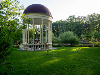 beautiful gazebo in the evening park near at the Lake