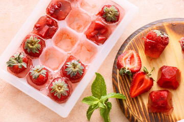 Tray with berries in ice on color background