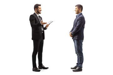 Businessman holding a clipboard and talking to a man