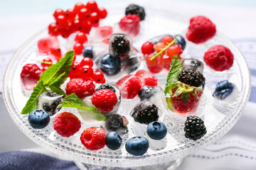 Ice with frozen berries on stand