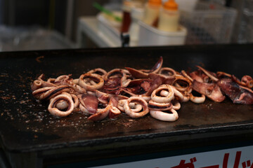 Close up of grilled octopus on a pan, Japanese food, soft focus