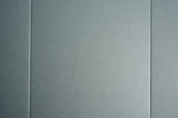 Fototapeta premium gray cardboard texture with folds, full frame
