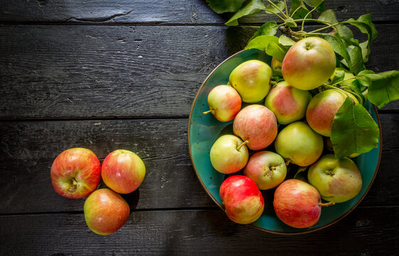 image of new crop apples on an old table