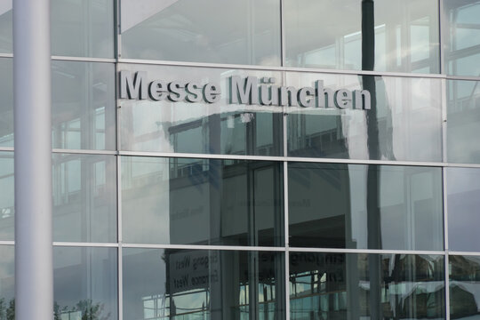 Munich, Bavaria / Germany - July 12, 2020: sign "Messe M&uuml;nchen" at the glass facade of the west entrance of the Munich trade fair in times of the Coronavirus Pandemic
