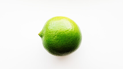 Bright green lime on a white background