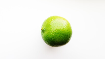 Bright green lime on a white background