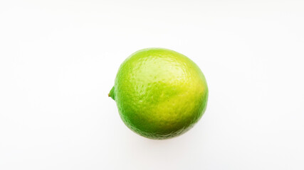 Bright green lime on a white background