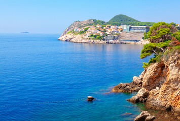 Fototapeta na wymiar Touristic resort in Dubrovnik . Scenery of Adriatic Sea. Coastal hotels in Croatia 