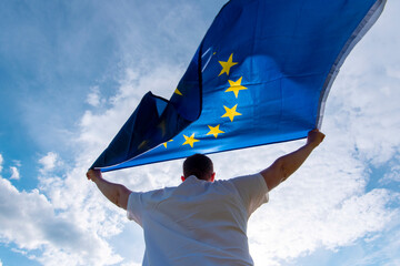 Man holding EU Flag or European Union flag, concept picture