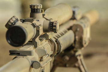 High military grade precising rifle scope lens in tan surface color attach on ar marksmanship rifle...