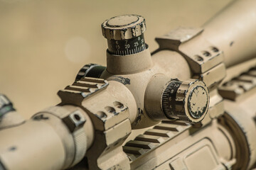 High military grade precising rifle scope lens in tan surface color attach on ar marksmanship rifle  