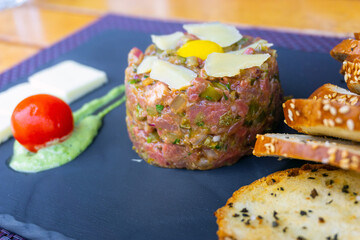 tasty Steak tartare (Raw beef) - classic steak tartare on white plate