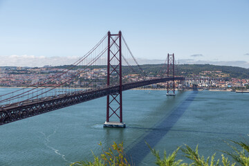 Bridge on April 25 in Lisbon on the Tejo river with moving cars.