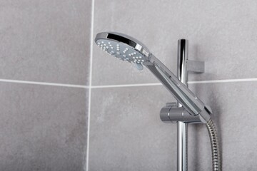 Modern style steel circular shower head in the bathroom