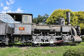 Fototapeta na wymiar Old locomotive next to the railway station