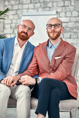 Happy homosexual Couple in office environment. Homosexual couple showing the world their pure love...