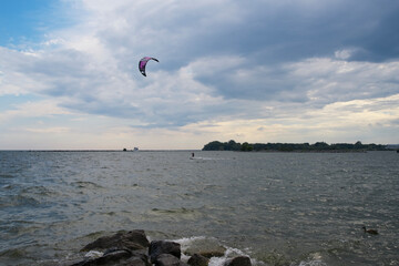 People parasailing on a river
