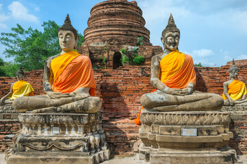 Fototapeta na wymiar Buddha statues around the central stupa, Wat Yai Chai Mongkhon, Ayutthaya, Thailand, Unesco World Heritage Site