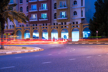 Fototapeta na wymiar Night street with light trails from cars