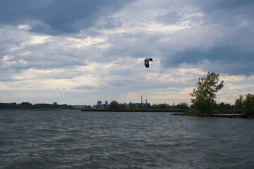 People parasailing on a river