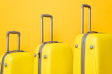 travel bags isolated on yellow background