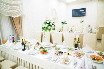 Interior of a restaurant prepared for wedding ceremony