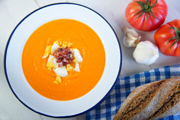 Traditional spanish Salmorejo. Cold tomato soup made with garlic, tomatoes, onion, bread and served...
