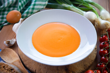 Traditional spanish Salmorejo. Cold tomato soup made with garlic, tomatoes, onion, bread and served with olive oil, iberico ham and boiled egg.